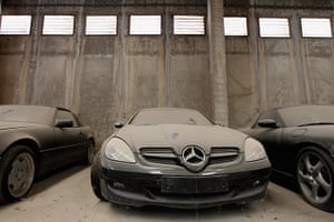 Greece scrapyard: Confiscated luxury cars inside a warehouse