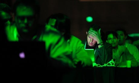 A patron works on his laptop during the Tech Crunch Disrupt conference in San Francisco, California, September 11.