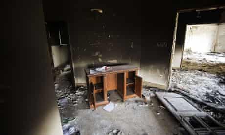 Damage inside the burnt US consulate building in Benghazi.  Libya said it has made arrests and opened a probe into the attack.