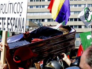 A group of demonstrators hold a mock coffin with an effigy of Spanish prime minister Mariano Rajoy during a protest against Spanish government austerity measures, on 15 September 2012.  Photograph: SERGIO BARRENECHEA/EPA