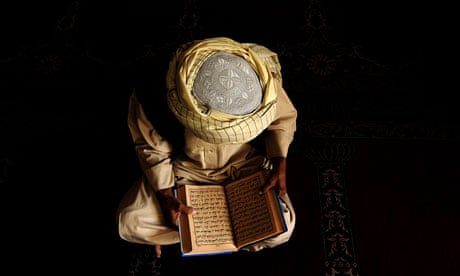 An Afghan Muslim reads the Koran in a mosque in Kabul