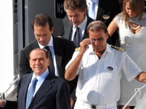 Former Italian premier Silvio Berlusconi (bottom left) disembarks from the MSC Divina for a stopover in Bari, southern Italy 16th September 2012. Berlusconi, who has recently hinted at a return to frontline politics, is on a week long cruise to the Mediterranean.