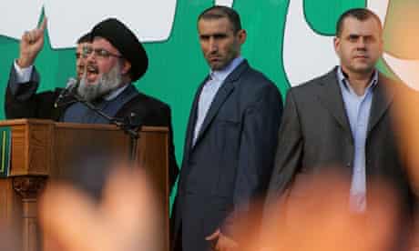 Bodyguards surround Hezbollah leader Hassan Nasrallah as he denounces the anti-Islam film