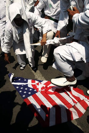Film protests: Medan, Indonesian: Muslim protesters step on a US flag