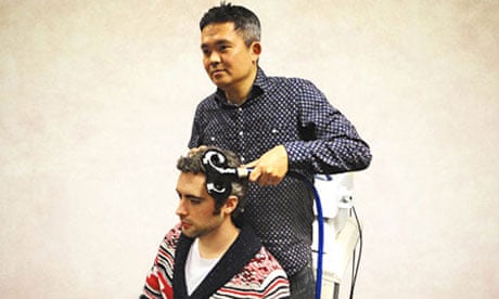 Co-author Ryota Kanai administering transcranial magnetic stimulation (TMS) to a participant's brain