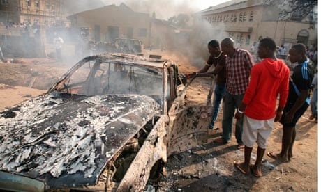 Wreckage of car bomb blast in Abuja after suspected Boko Haram attack