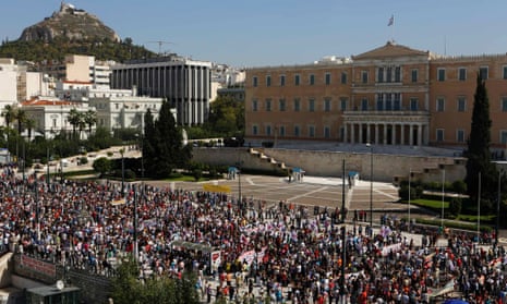 Supporters of the Greek Communist party march by the parliament during a 24-hour labour strike in Athens September 26, 2012.
