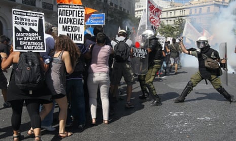 Protesters  clash with riot policemen during a  a general strike demonstration in Athens, Greece, on 26 September 2012. Greek trade unions called a 24-hour general strike to oppose new austerity measures.