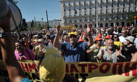 Protestors chant slogans in front of the parliament on September 26, 2012 during a 24-hours general strike in Athens. 