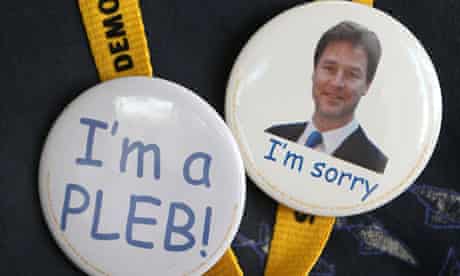 Badges mocking Conservative MP Andrew Mitchell and celebrating party leader Nick Clegg's apology. 