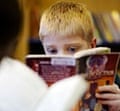 A boy reading in his school library