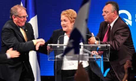 Pauline Marois is whisked off stage