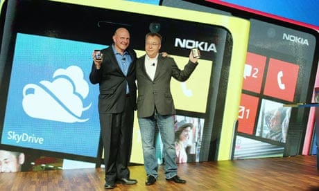 Steve Ballmer of Microsoft (left) and Stephen Elop of Nokia with Nokia's new smartphones