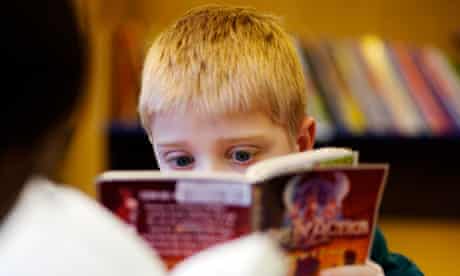 Child reads in library