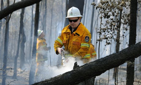 Firefighters douse burning logs near Deans Gap