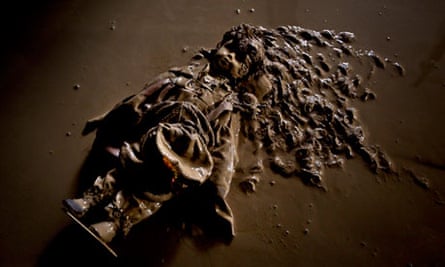 A doll covered with mud