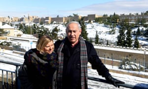 Binyamin Netanyahu and his wife Sara in a snowy Jerusalem on 10 January 2013.