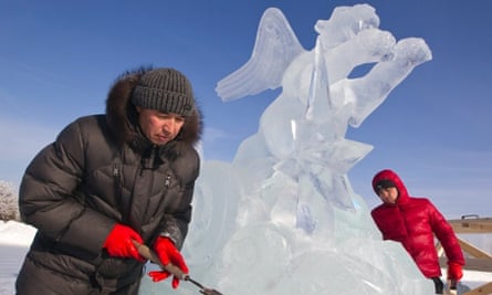 Frozen tiger - hidden dragon: Sculptors make a final touch to their creation during ice and snow sculptures festival at the "Eight Lakes" Park-Resort outside Almaty, Kazakhstan.