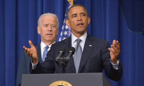 Obama speaks on proposals to reduce gun violence as vice president Joe Biden watches at the White House.