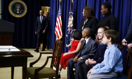 Children and the families of children who wrote to the president after the Newtown massacre watch Barack Obama arrive for the gun control announcement.