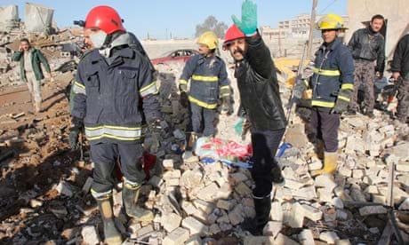 Rescuers on the scene after a bomb attack in Kirkuk, Iraq, on 16 January 2013 