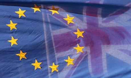 A European Union flag flies next to a union flag at the European parliament