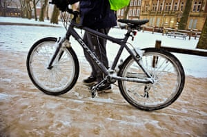 snow in uk: A cyclist in Bristol