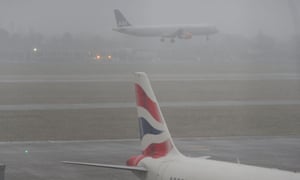 A plane comes in to land at Heathrow airport as the forecast suggests snow will reach the London area later today after snow shut roads and disrupted train travel today in other parts of the UK, but the major commuter belt areas of southern England escaped the worst of the morning hazards.