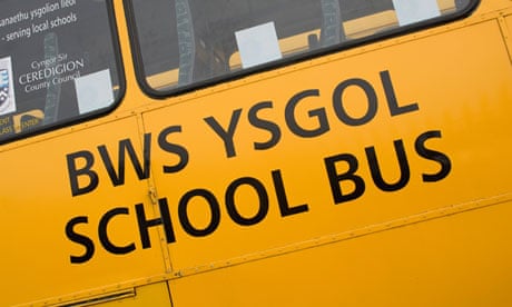 Bilingual Welsh and English signs on a school bus. 