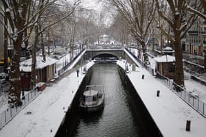 Paris snow: Snow covers paths alongside the Canal Saint-Martin