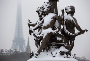 Paris snow: Snow blankets statues on the Alexander III bridge