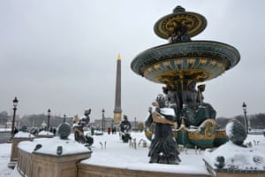 Paris snow: A snow-covered fountain at the Place de