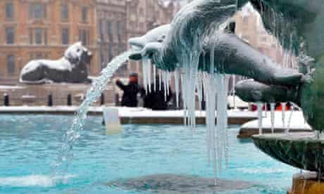 Ice hangs from fountains in Trafalgar Square, London 