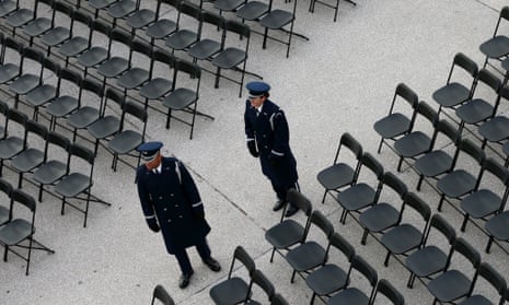 Members of the military stand next to empty seats before the presidential inauguration.