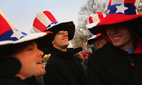 People wearing silly hats gather near the U.S. Capitol building.