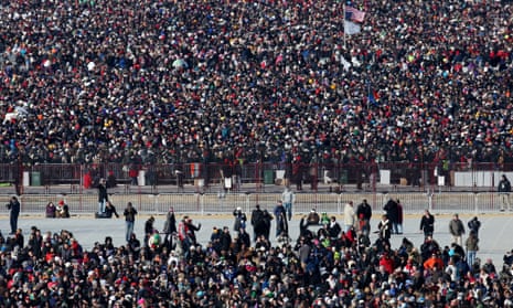 Crowds gather as they await for the start of the presidential inauguration.