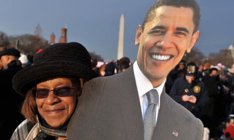 A woman stands with Barack Obama ahead of the inauguration. Ok, it's not really him, just a cardboard cut out.