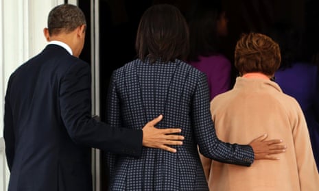 Lending a hand. Barack Obama arrives back at the White House with Michelle and his mother-in-law Marian Robinson after attending a church service.