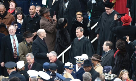 Chief Justice of the Supreme Court John Roberts (C) arrives on the West Front of the US Capitol one hour before US President Barack Obama is ceremonially sworn in.