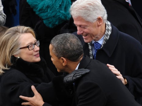 Obama is greeted by Secretary of State Hillary Clinton and former President Bill Clinton.