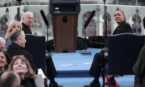 Obama Joe Biden sit during the presidential inauguration.