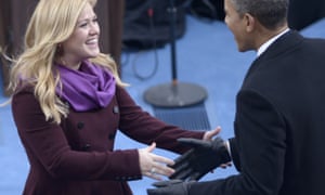 US President Barack Obama greets singer Kelly Clarkson as she performs during the inauguration ceremony.