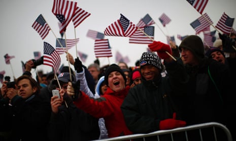 Spectators react to Obama's speech on the Mall.