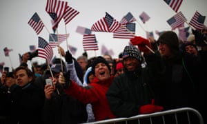 Spectators react to Obama's speech on the Mall.