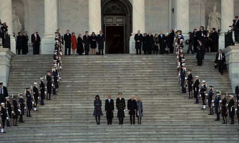 Barack Obama, Michelle, US Vice President Joe Biden his wife Jill Biden and Major General Michael Linnington (centre), review the troops at the Capitol.