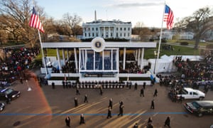 Barack Obama walks down Pennsylvania Avenue to the White House during the inaugural parade.