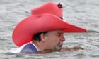A man with a pink cowboy hat