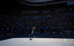 20 Photos: Russia's Maria Sharapova hits a backhand to Ekaterina Makarova