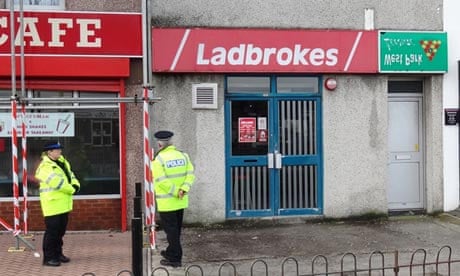 Police at the Ladbrokes branch on Crownhill Road, Plymouth, Devon