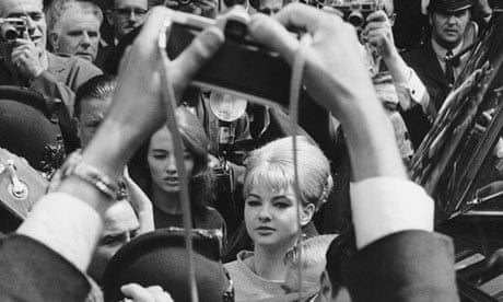 Mandy Rice-Davies framed by photographer's arms